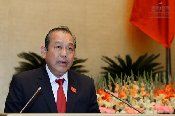 Phó Thủ tướng Chính phủ Trương Hòa Bình trả lời chất vấn trước Quốc hội về những vấn đề liên quan thuộc trách nhiệm của Chính phủ.